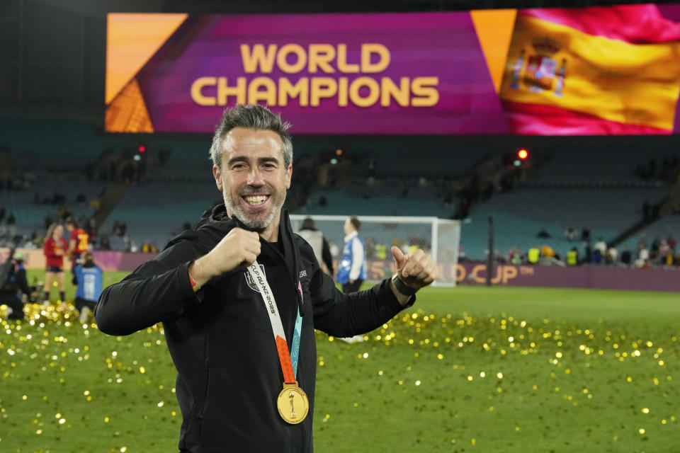 Spain's head coach Jorge Vilda celebrates with the gold medal after the final of Women's World Cup soccer between Spain and England at Stadium Australia in Sydney, Australia, Sunday, Aug. 20, 2023. (AP Photo/Rick Rycroft)