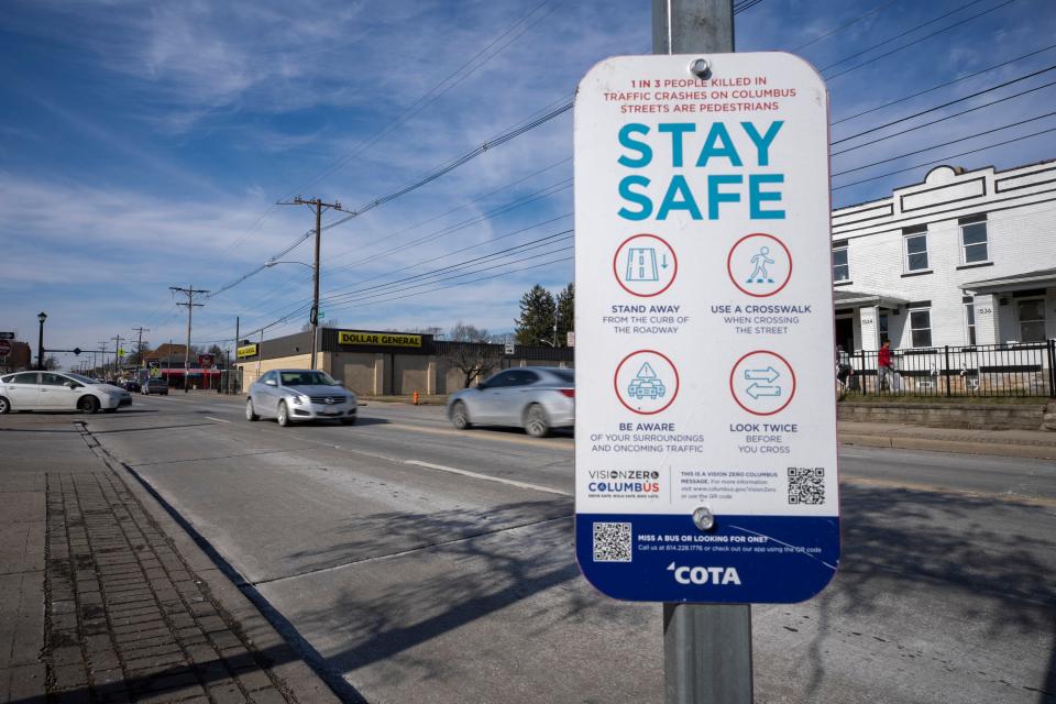 Vehicles drive along East Livingston Avenue past a Central Ohio Transit Authority safety sign on Wednesday afternoon. The federal government is awarding Columbus $12 million to help pay for a $24-million project to improve safety along Livingston Avenue between South 18th Street and Nelson Road.