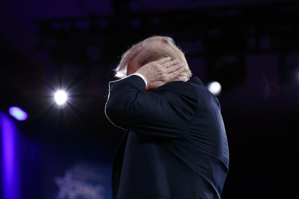 <p>President Donald Trump gestures as he makes a joke about his hair during remarks to the Conservative Political Action Conference, Friday, Feb. 23, 2018, in Oxon Hill, Md. (Photo: Evan Vucci/AP) </p>