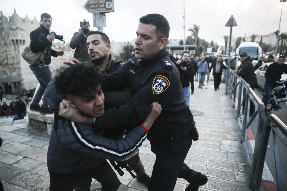 Israeli border police arrests a Palestinian ahead of a protest against Middle East peace plan announced Tuesday by US President Donald Trump, which strongly favors Israel, in Jerusalem, Wednesday, Jan 29, 2020. (AP Photo/Mahmoud Illean)