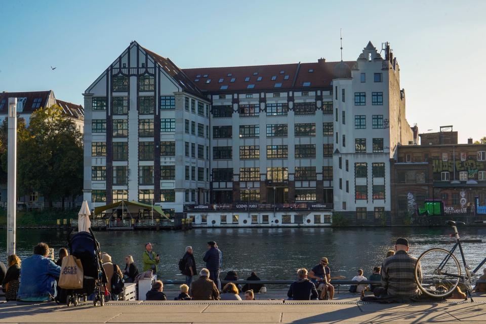 People relax by the water in Berlin.