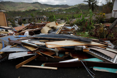 Debris is seen outside a home damaged by Hurricane Maria is seen in the Trujillo Alto municipality outside San Juan, Puerto Rico, October 9, 2017. REUTERS/Shannon Stapleton