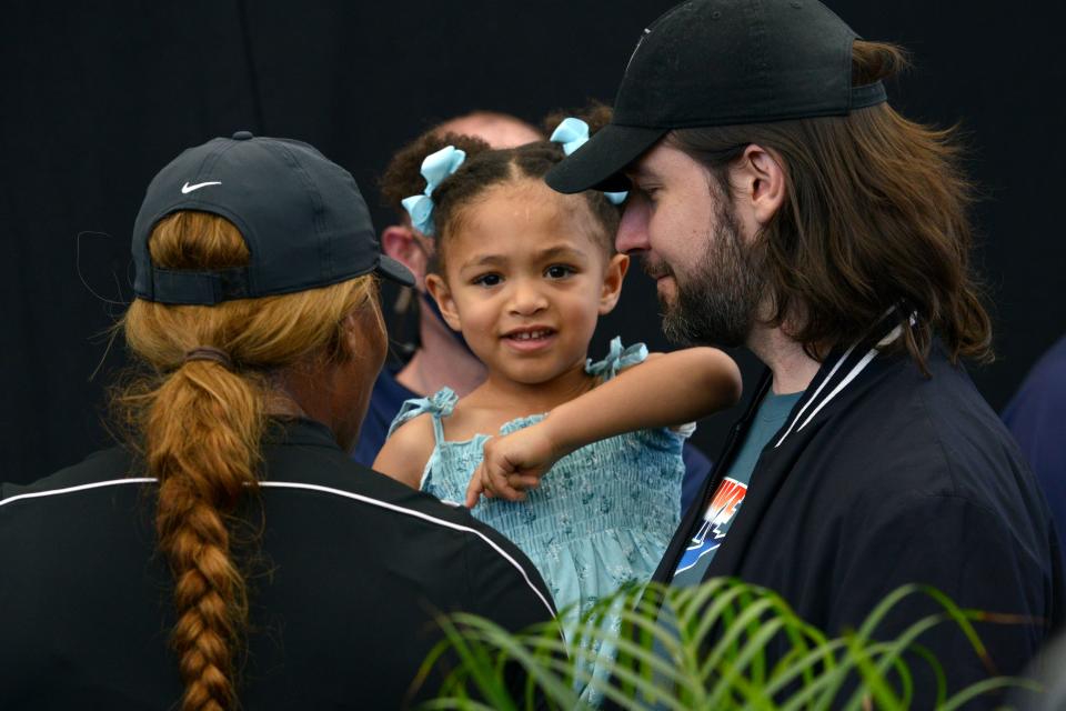 Serena Williams (L) of the US and her husband Alexis Ohanian talk to their daughter Alexis Olympia Ohanian Jr during the 'A Day at the Drive' exhibition tournament in Adelaide on January 29, 2021. (Photo by Brenton Edwards / AFP) / -- IMAGE RESTRICTED TO EDITORIAL USE - STRICTLY NO COMMERCIAL USE -- (Photo by BRENTON EDWARDS/AFP via Getty Images)