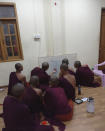 In this undated photo provided to The Associated Press in September 2021, monks gather to make a diagram of Obo Prison located in Mandalay, Myanmar. The AP spoke to two monks from the same monastery who were preparing to protest against the military when they were arrested and beaten. While in detention, they say they were forced to jump like frogs -- a common punishment in the Myanmar detention system. (AP Photo)