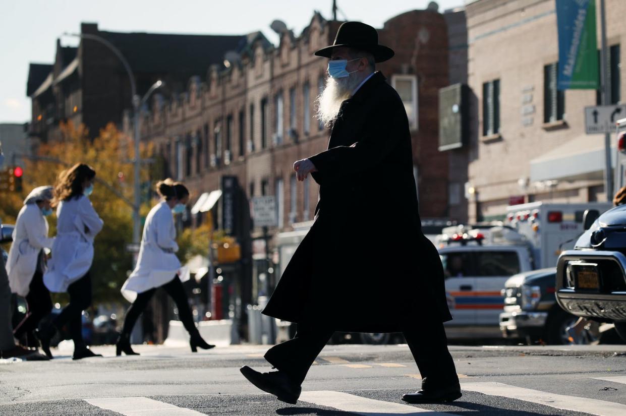 <span class="caption">FBI announcements in Yiddish encourage Hasidic or "ultra-Orthodox" Jews to report incidents of anti-Semitism.</span> <span class="attribution"><a class="link " href="https://www.gettyimages.com/detail/news-photo/hasidic-man-walks-by-the-maimonides-medical-center-on-news-photo/1287323694?adppopup=true" rel="nofollow noopener" target="_blank" data-ylk="slk:Spencer Platt/Getty Images;elm:context_link;itc:0;sec:content-canvas">Spencer Platt/Getty Images</a></span>