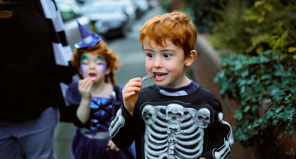 Boy dressed up in Halloween skeleton costume