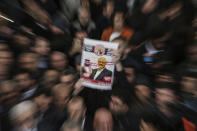 A person holds up a banner as members of the Arab-Turkish Media Association and friends attend funeral prayers in absentia for Saudi writer Jamal Khashoggi who was killed last month in the Saudi Arabia consulate, in Istanbul, Friday, Nov. 16, 2018. Turkey's Foreign Minister Mevlut Cavusoglu on Thursday called for an international investigation into the killing of Saudi dissident Jamal Khashoggi. (AP Photo/Emrah Gurel)