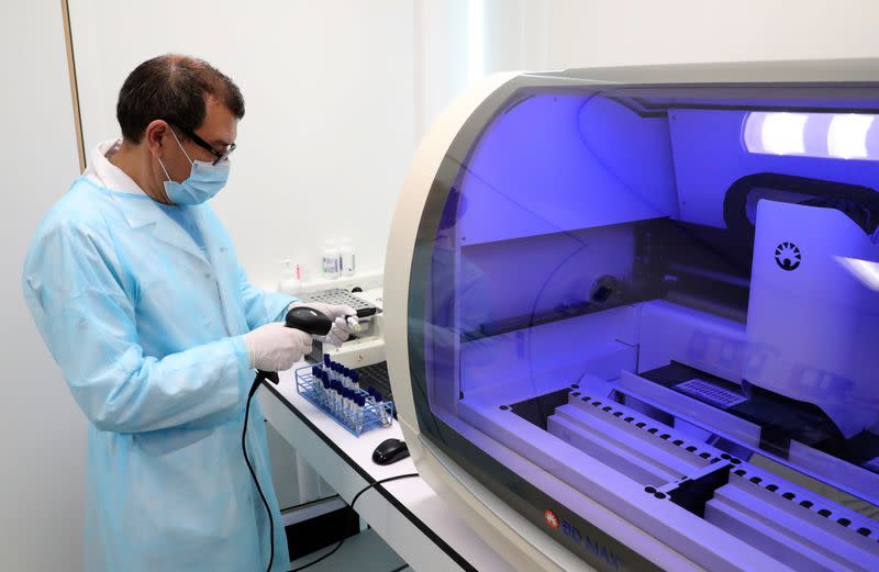 A laboratory worker checks the coronavirus disease (COVID-19) tests at the CHIREC Delta Hospital in Brussels