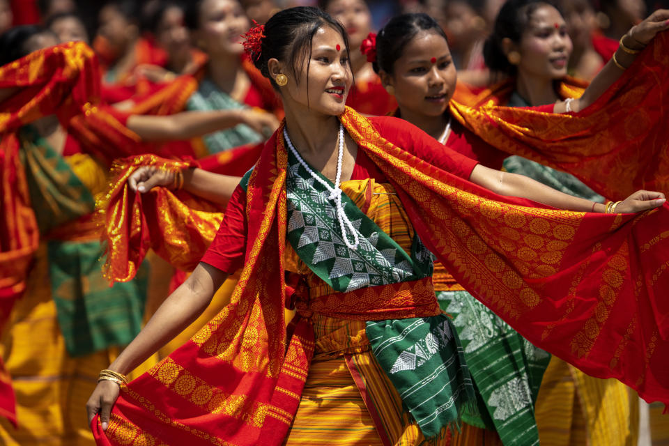 Tribal Bodo girls in traditional attire perform Sikhlai dance on Independence Day in Gauhati, northeastern Assam state, India, Monday, Aug. 15, 2022. The country is marking the 75th anniversary of its independence from British rule. (AP Photo/Anupam Nath)