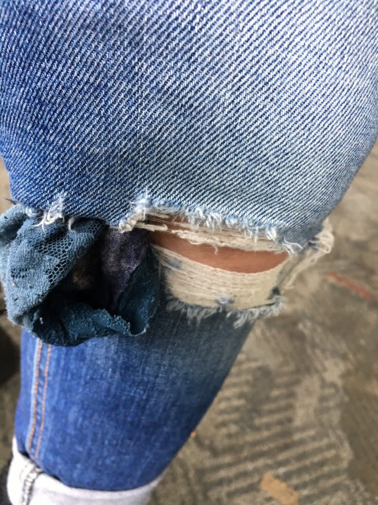 Idina didn’t notice that her old knickers were hanging out of her ripped jeans.