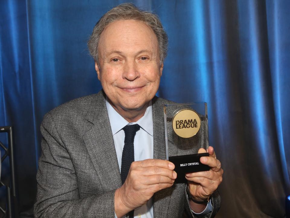 Billy Crystal poses with his Contribution to the Theater Award at the 88th Annual Drama League Awards at The Ziegfeld Ballroom on May 20, 2022