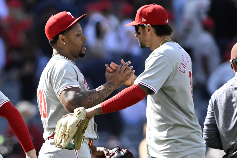 Philadelphia Phillies relief pitcher Gregory Soto, left, greets right fielder Nick Castellanos after the Phillies defeat the Los Angeles Angels in a baseball game in Anaheim, Calif., Wednesday, May 1, 2024. (AP Photo/Alex Gallardo)