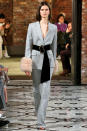 <p>Model wears a gray pantsuit and waist belt at the fall 2018 Adeam show. (Photo: Getty Images) </p>