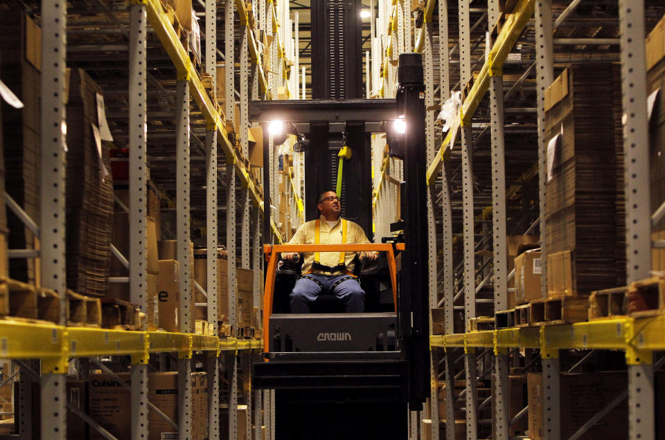 An associate at the Macy's-Bloomingdale's fulfillment center works down an aisle of packing boxes in Martinsburg, West Virginia December 6, 2012.     
 REUTERS/Gary Cameron   (UNITED STATES - Tags: BUSINESS)