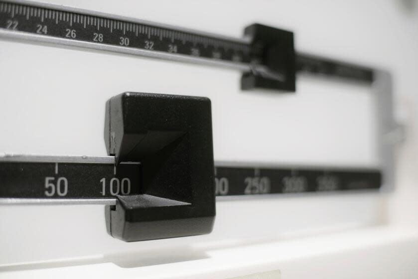 FILE- A closeup of a beam scale is seen in New York on April 3, 2018. Tirzepatide, a drug from Eli Lilly and Co. approved to treat type 2 diabetes under the brand name Mounjaro, helped people with the disease who were overweight or had obesity lose up to 16% of their body weight, or more than 34 pounds, over nearly 17 months, the company said on Thursday, April 27, 2023. (AP Photo/Patrick Sison, File)