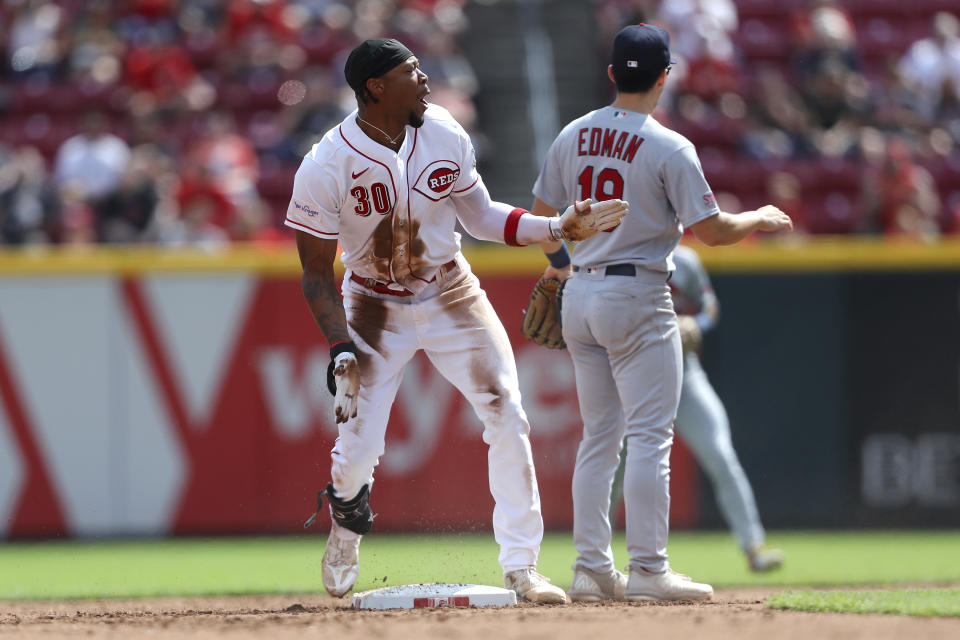 Cincinnati Reds' Will Benson (30) celebrates after hitting a double during the sixth inning of a baseball game against the St. Louis Cardinals, Sunday Sept. 10, 2023, in Cincinnati. (AP Photo/Joe Maiorana)