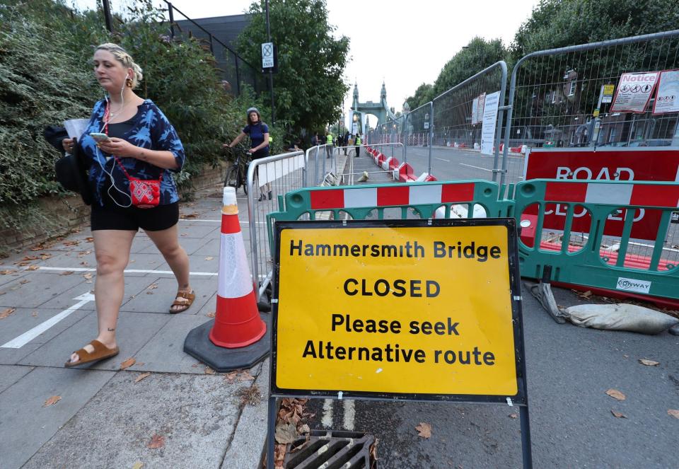 Pedestrians are seen on the bridge, which was suddenly closed on Thursday (PA)