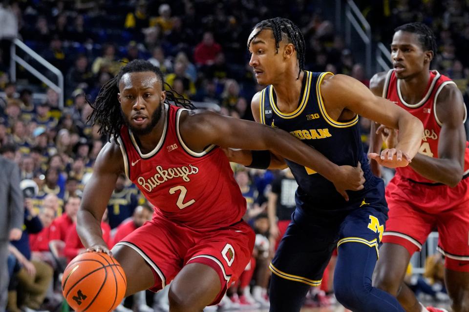 Ohio State guard Bruce Thornton drives as Michigan's Kobe Bufkin defends on Sunday.