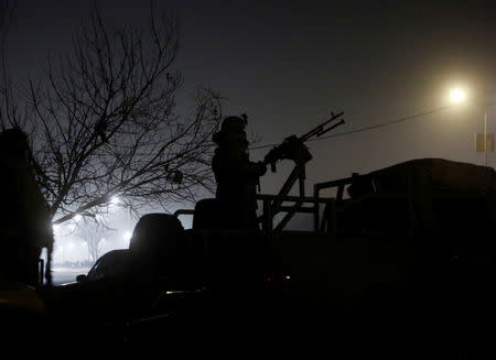 A member of the Afghan security forces keeps watch near the site of an attack on the Intercontinental Hotel in Kabul, Afghanistan January 20, 2018. REUTERS/Omar Sobhani