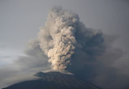 FILE PHOTO: Mount Agung volcano erupts as seen from Kubu, Karangasem Regency, Bali, Indonesia November 28, 2017. REUTERS/Darren Whiteside/File Photo