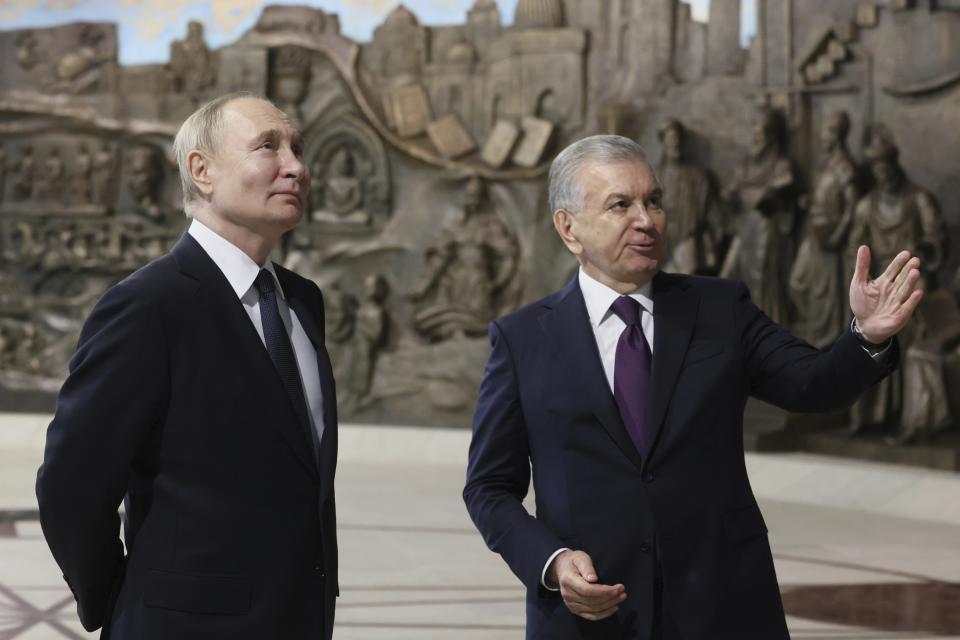 Russian President Vladimir Putin, left, and Uzbek President Shavkat Mirziyoyev visit Yangi O'zbekiston park during their meeting in Tashkent, Uzbekistan, Sunday, May 26, 2024. (Mikhail Metzel, Sputnik, Kremlin Pool Photo via AP)