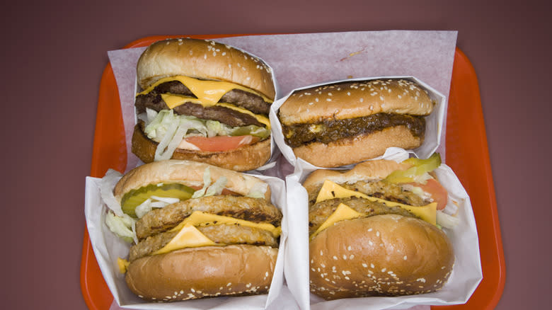 Burgers with topping in tray