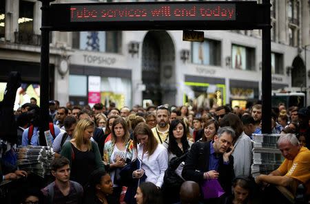 Commuters try to enter Oxford Circus Underground station shortly before the start of a 24 hour strike in London, Britain August 5, 2015. REUTERS/Darren Staples