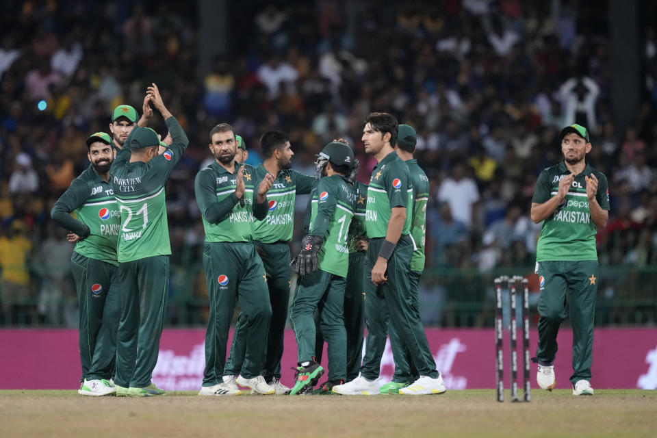 Pakistan's Iftikhar Ahmed is congratulated by teammates for the wicket of Sri Lanka's Kusal Mendis during the Asia Cup cricket match between Pakistan and Sri Lanka in Colombo, Sri Lanka on Thursday, Sept.14, 2023. (AP Photo/Eranga Jayawardena)