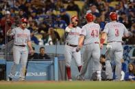 May 12, 2018; Los Angeles, CA, USA; Cincinnati Reds center fielder Scott Schebler (43) is congratulated by third baseman Eugenio Suarez (7) after hitting a three-run home run during the sixth inning against the Los Angeles Dodgers at Dodger Stadium. Mandatory Credit: Orlando Ramirez-USA TODAY Sports