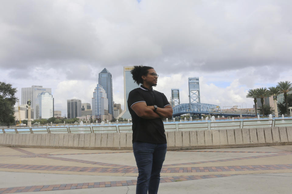 Michael Sampson poses for photo at Friendship Fountain in Jacksonville, Fla., on Friday, Oct. 23, 2020. Sampson cofounded the Jacksonville Community Action Committee to help drive change in a city emerging from its Confederate past. (AP Photo/Bobby Caina Calvan)