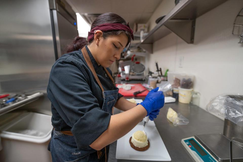 Twenty One Steak pastry chef Francisca Chacon prepares a frozen green chile tart for the dessert category of the Greater Pueblo Chamber of Commerce Spice Up Spring contest on Friday.