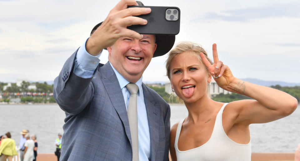 Leader of the Opposition Anthony Albanese and 2021 Australian of the Year Grace Tame take a selfie after an Australia Day Citizenship Ceremony and Flag Raising event in Canberra.