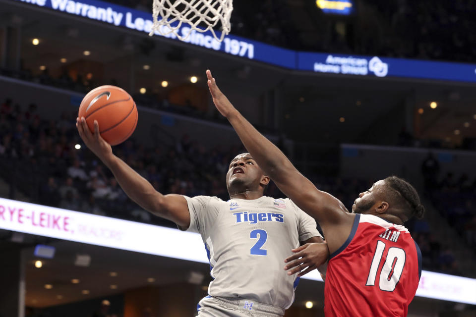 Memphis' Alex Lomax (2) goes up for a shot as Illinois-Chicago's Deon Ejim (10) defends during the second half of an NCAA college basketball game, Friday, Nov. 8, 2019, in Memphis, Tenn. (AP Photo/Karen Pulfer Focht)