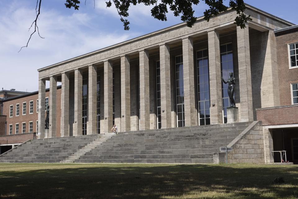 The Olympic sports school building on the grounds of the former Reich Sports Field constructed for the 1936 Olympics is pictured in Berlin, Germany, Wednesday, July 10, 2024. Scars of World War II and relics from its Nazi past are preserved at Berlin's Olympiastadion. When Spain plays England in the European Championship final, they will be playing in a stadium that doesn't hide it was built by the Nazis for the 1936 Olympic Games. (AP Photo/Ciaran Fahey)