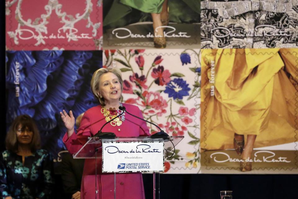 Hillary Clinton speaks during an unveiling postage stamps honoring the late fashion designer Oscar de la Renta in Grand Central Terminal, in New York, Thursday, Feb. 16, 2017. Clinton has praised Oscar de la Renta as an inspiration to striving immigrants like himself at an event honoring the late fashion designer with a series of commemorative stamps. (AP Photo/Richard Drew)