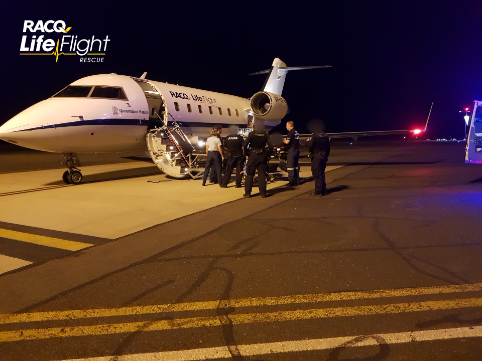 One of the victims shown being loaded into an RACQ plane. Source: RACQ LifeFlight