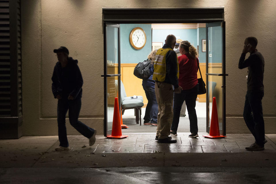 <p>People are evacuated to a nearby church after three women were reportedly shot dead and a man critically injured following a shooting at the Cascade Mall shopping center on September 23, 2016 in Burlington, Washington. (Photo: Karen Ducey/Getty Images) </p>