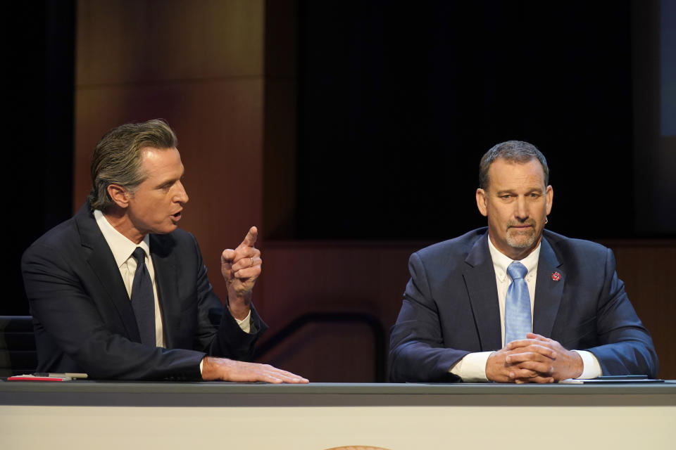 Gubernatorial candidates Democratic Gov. Gavin Newsom, left, and Republican challenger state Sen. Brian Dahle spar during their debate held by KQED Public Television in San Francisco, on Sunday, Oct. 23, 2022. (AP Photo/Rich Pedroncelli, Pool)