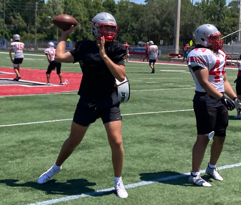 Lake Mary rising sophomore quarterback Noah Grubbs throws a pass in practice Wednesday.