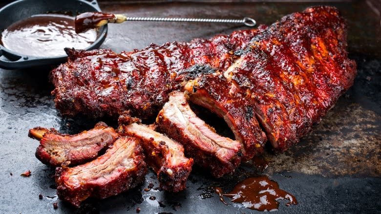 A slab of barbecue ribs with sauce