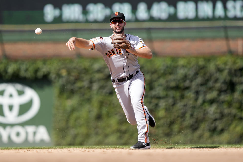 San Francisco Giants shortstop Paul DeJong throws Chicago Cubs' Nico Hoerner out at first during the sixth inning of a baseball game Monday, Sept. 4, 2023, in Chicago. (AP Photo/Charles Rex Arbogast)