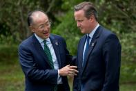 British Prime Minister David Cameron (right) speaks with World Bank President Jim Yong Kim at the G7 summit in Ise Shima, Japan, on May 27, 2016