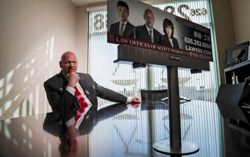 SAN GABRIEL, CA, MARCH 27, 2023 - Portrait of attorney Scott Warmuth, whose billboard ads have made him a fixture in the Chinese community, at his office in San Gabriel. (Robert Gauthier/Los Angeles Times)