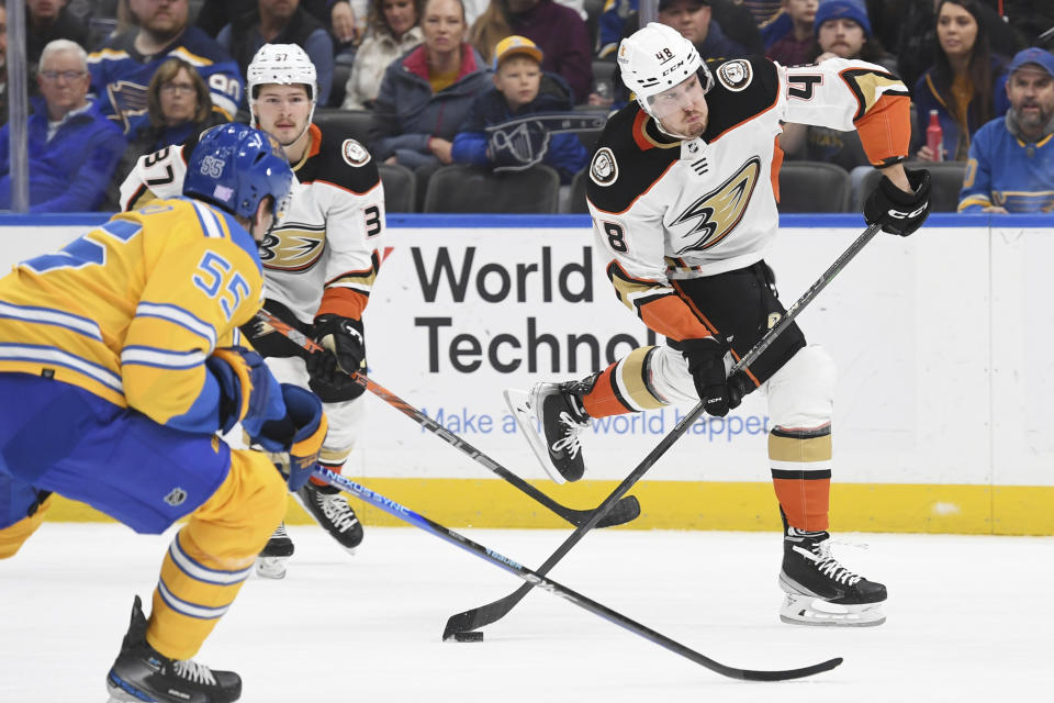 Anaheim Ducks' Austin Strand shoots the puck against the St. Louis Blues during the first period of an NHL hockey game, Monday, Nov. 21, 2022, in St. Louis. (AP Photo/Michael Thomas)