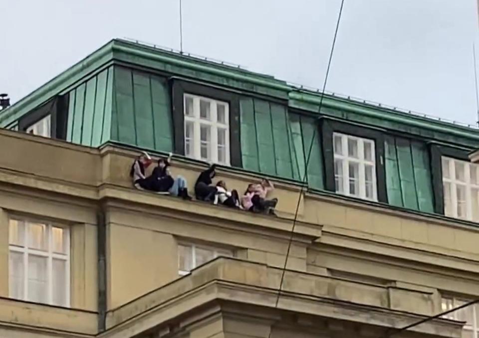 Images and videos on social media shows eight students perched on a ledge to hide from the gunman (Instagram)
