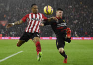Southampton's Nathaniel Clyne in action with Liverpool's Alberto Moreno Reuters / Dylan Martinez Livepic