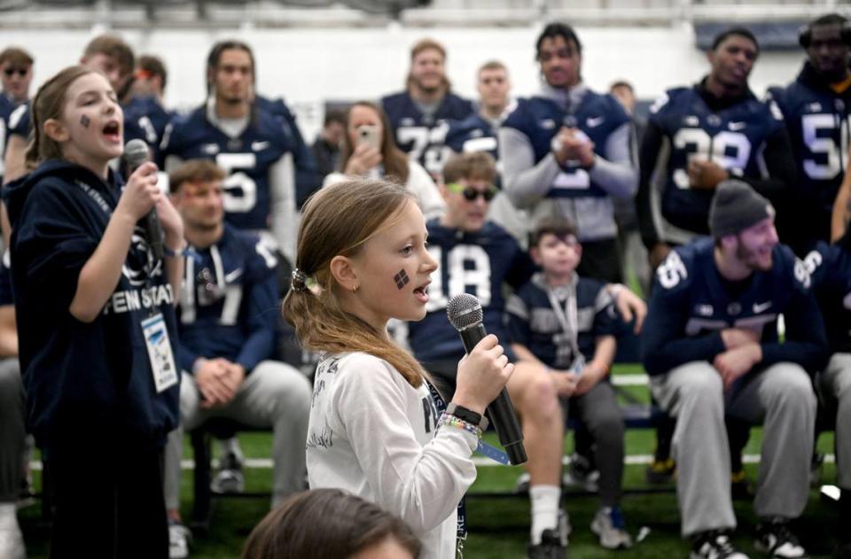 Sarah Zeisloft, 11, sings karaoke to a Taylor Swift song to cheers from the Penn State football players on Saturday, Feb. 17, 2024 in Holuba Hall.  