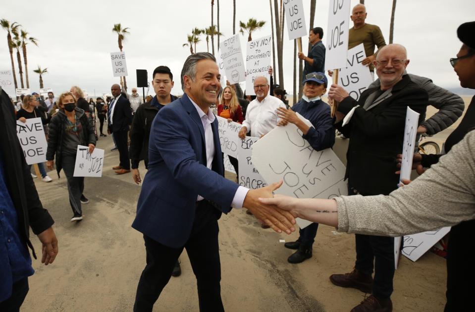 Los Angeles mayoral candidate Joe Buscaino talks with supporters.