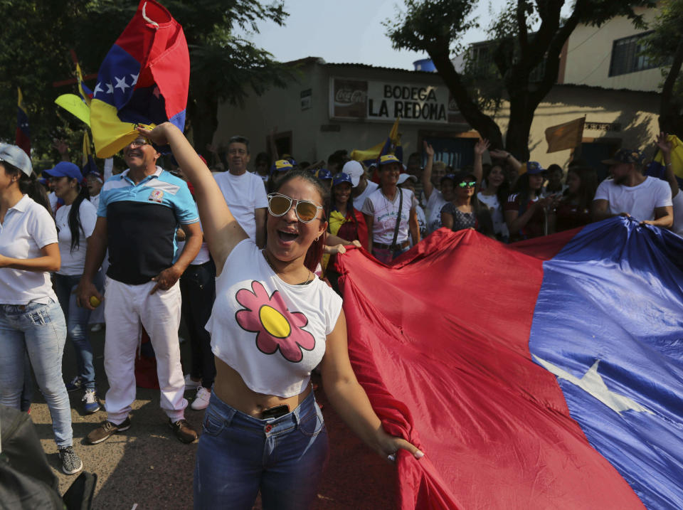 A woman shouts slogans against Venezuela's President Nicolas Maduro during a protest against his government in Urena, Venezuela, Tuesday, Feb. 12, 2019. Nearly three weeks after the Trump administration backed an all-out effort to force out President Nicolas Maduro, the embattled socialist leader is holding strong and defying predictions of an imminent demise. (AP Photo/Fernando Llano)