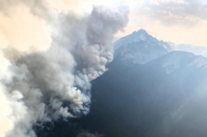 An aerial photo taken by the BC Wildfire Service shows smoke billowing up from the Bendor Range Complex wildfire near Lillooet, British Columbia, Canada, on Saturday. About 71,000 B.C. residents remained under evacuation orders or alerts due the raging fires. Photo courtesy BC Wildfire Service/X